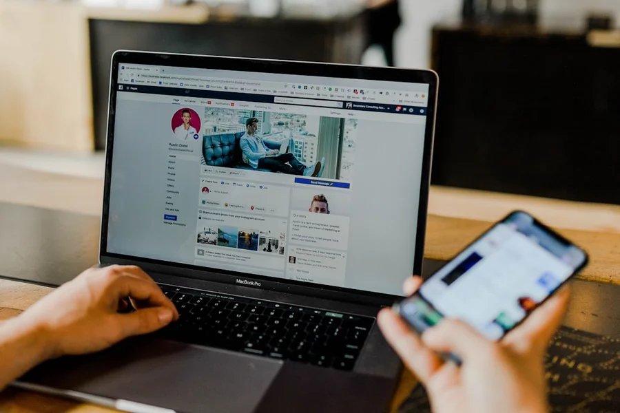AI Social Media Content Creation A person using a tablet to create social media content with various AI tool icons floating around the screen.