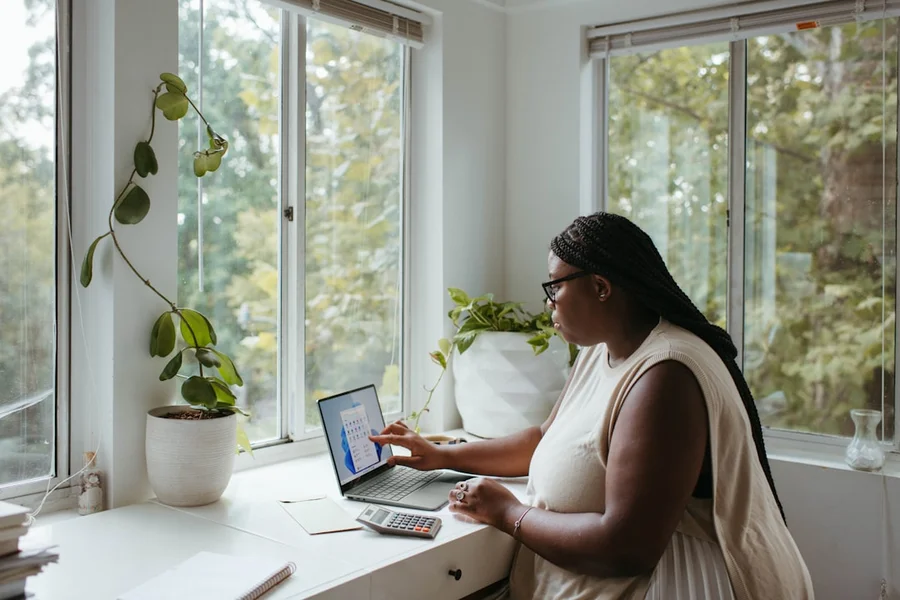 Person effectively managing remote tasks with digital tools for smarter, not harder, work.