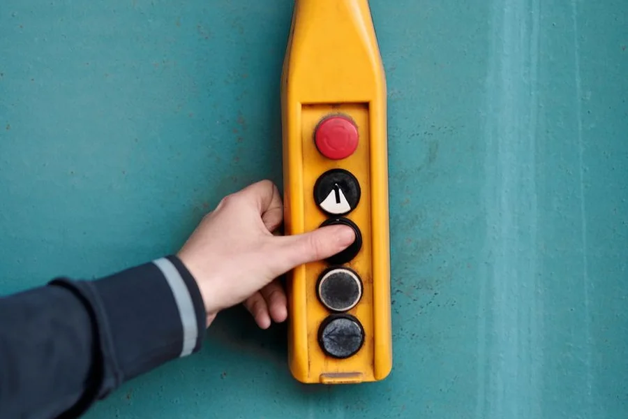 Buzzer Practice Technique A hand pressing a signaling device button to practice r Jeopardy buzzer lockout timing