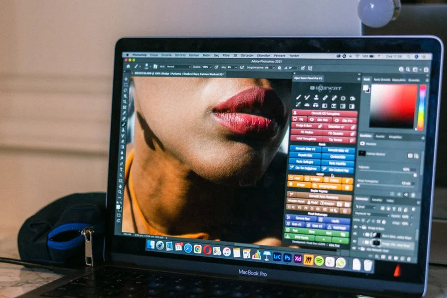 Creative Visual Graphics Workspace A creative designer editing graphic visual assets on a laptop in a modern workspace