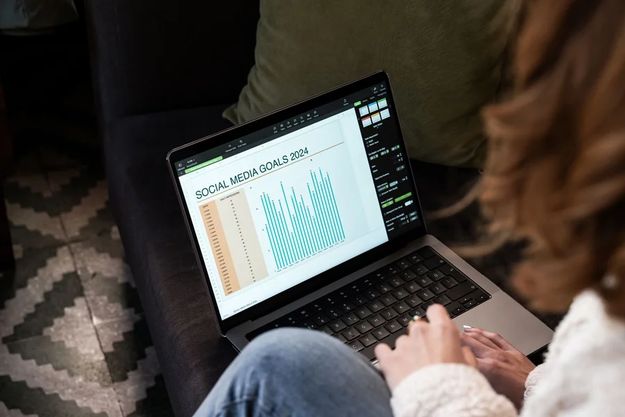 A laptop screen displaying data charts representing rolling user quota limits