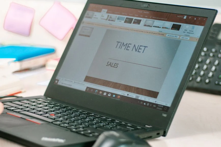 A modern presentation slide deck layout shown on a laptop screen on an office desk